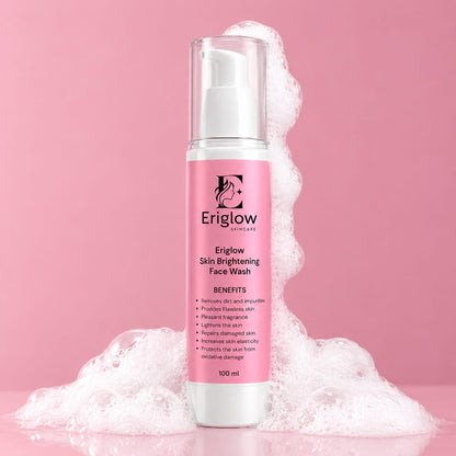 Eriglow Skin Brightening Face Wash bottle with pink label and white foam on a pink background